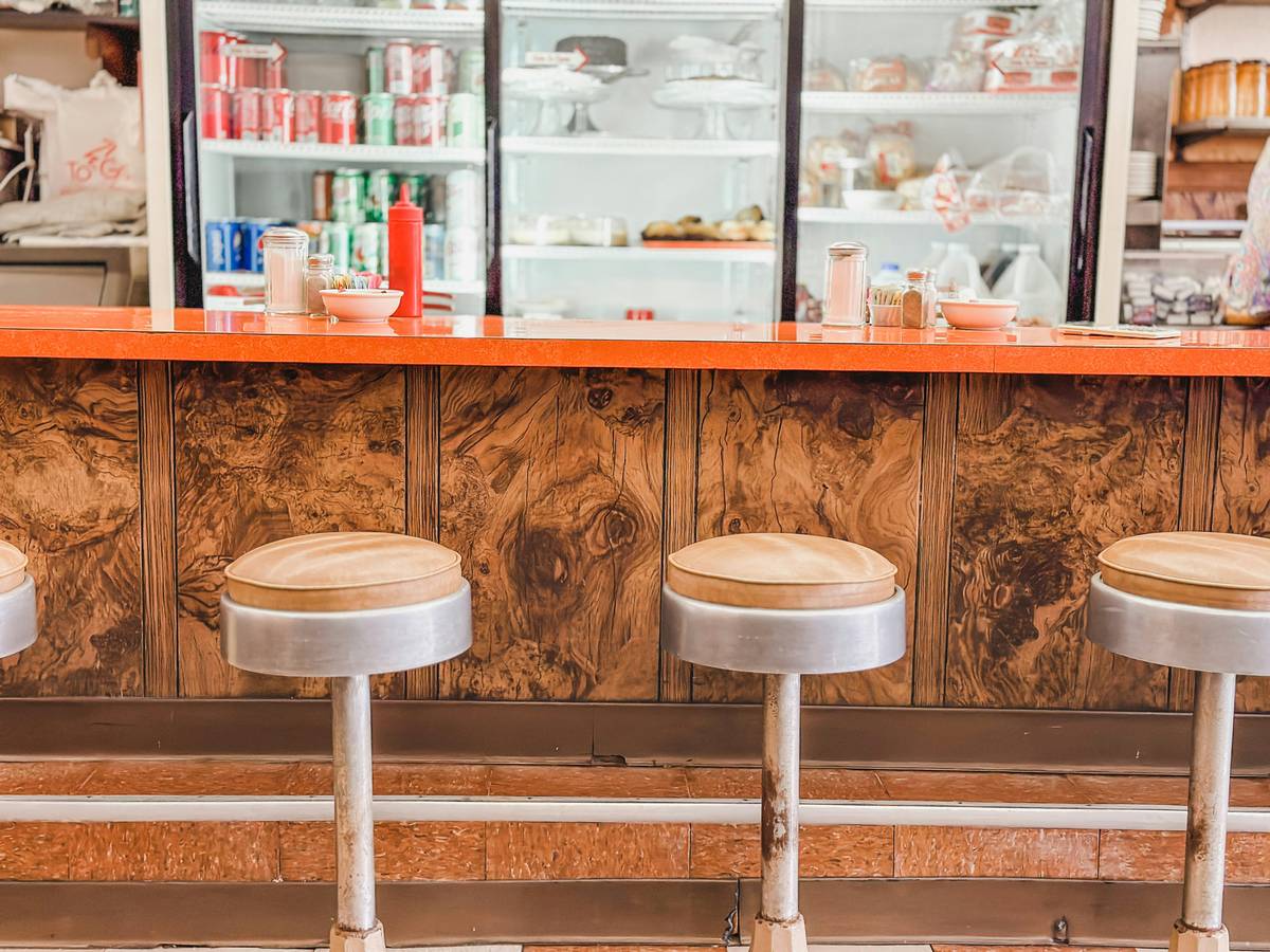 Industrial bar stools for restaurant style with steel frames and leatherette seats in a modern kitchen